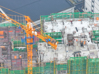 Workers are working on a community construction site in Jinping County, Guizhou Province, China, on January 1, 2023. (