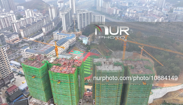 Workers are working on a community construction site in Jinping County, Guizhou Province, China, on January 1, 2023. 