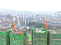 Workers are working on a community construction site in Jinping County, Guizhou Province, China, on January 1, 2023. (