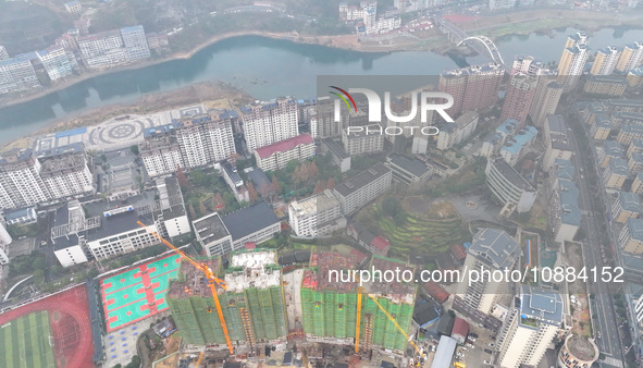 Workers are working on a community construction site in Jinping County, Guizhou Province, China, on January 1, 2023. 