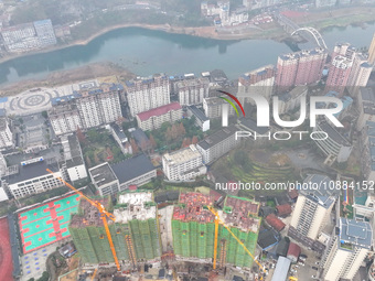 Workers are working on a community construction site in Jinping County, Guizhou Province, China, on January 1, 2023. (