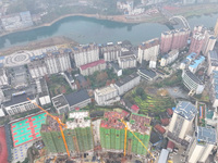 Workers are working on a community construction site in Jinping County, Guizhou Province, China, on January 1, 2023. (