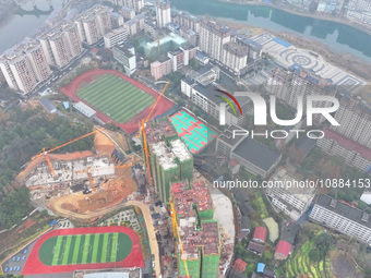 Workers are working on a community construction site in Jinping County, Guizhou Province, China, on January 1, 2023. (