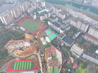 Workers are working on a community construction site in Jinping County, Guizhou Province, China, on January 1, 2023. (