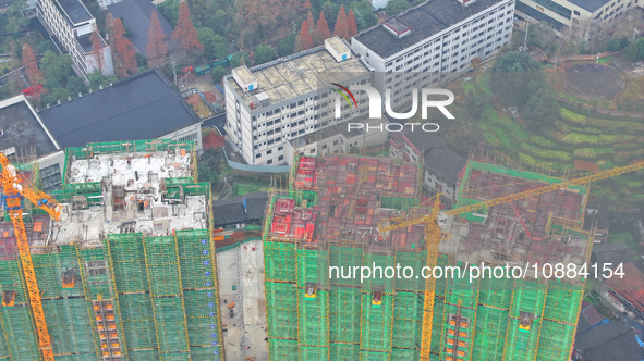 Workers are working on a community construction site in Jinping County, Guizhou Province, China, on January 1, 2023. 