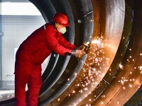 A worker is grinding at a workshop of an equipment manufacturing company in the Qingzhou Economic Development Zone, in Qingzhou, China, on J...