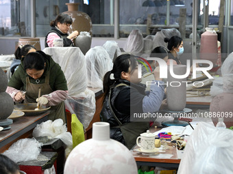 Workers are making ceramic products at a ceramic enterprise in Handan, Hebei Province, China, on January 2, 2024. (