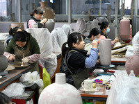 Workers are making ceramic products at a ceramic enterprise in Handan, Hebei Province, China, on January 2, 2024. (