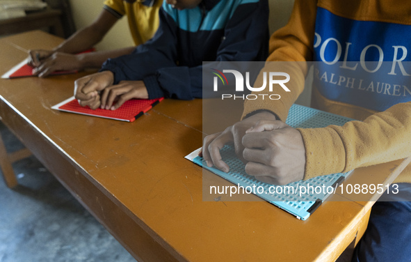 Visually impaired students are writing using the Braille system at Guwahati Blind High School in Guwahati, Assam, India, on January 4, 2024....