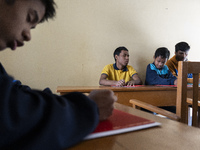 Visually impaired students are writing using the Braille system at Guwahati Blind High School in Guwahati, Assam, India, on January 4, 2024....