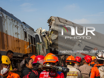 Search and rescue teams are searching for and evacuating victims after the Bandung Raya local train collided with the Turangga train in Cica...