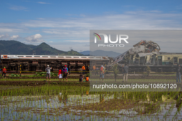 Search and rescue teams are searching for and evacuating victims after the Bandung Raya local train collided with the Turangga train in Cica...