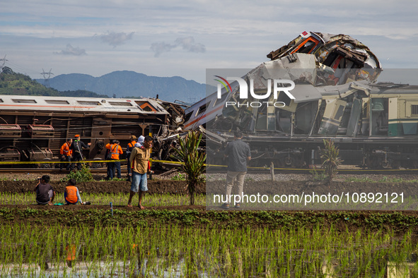 Search and rescue teams are searching for and evacuating victims after the Bandung Raya local train collided with the Turangga train in Cica...