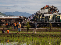 Search and rescue teams are searching for and evacuating victims after the Bandung Raya local train collided with the Turangga train in Cica...