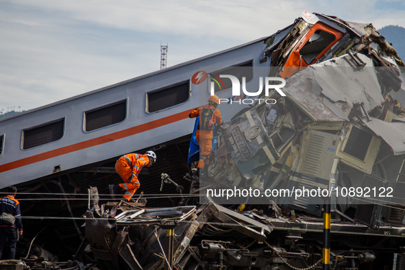 Search and rescue teams are searching for and evacuating victims after the Bandung Raya local train collided with the Turangga train in Cica...