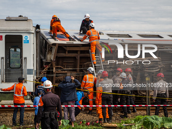 Search and rescue teams are searching for and evacuating victims after the Bandung Raya local train collided with the Turangga train in Cica...