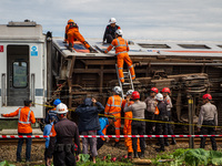 Search and rescue teams are searching for and evacuating victims after the Bandung Raya local train collided with the Turangga train in Cica...