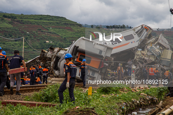 Search and rescue teams are evacuating after the Bandung Raya local train collided with the Turangga train in Cicalengka, Bandung Regency, W...