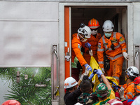 Search and rescue teams are evacuating after the Bandung Raya local train collided with the Turangga train in Cicalengka, Bandung Regency, W...