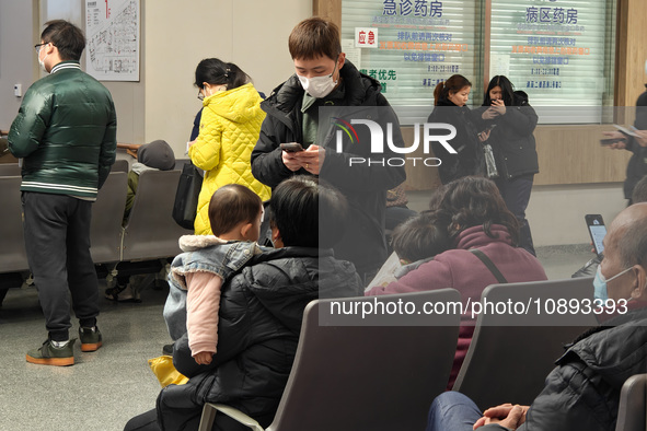 Patients with respiratory diseases are in the pediatric emergency department of Xinhua Hospital in Shanghai, China, on the night of January...