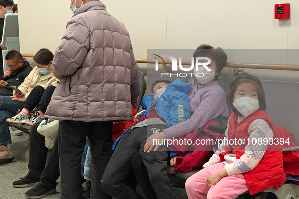 Patients with respiratory diseases are in the pediatric emergency department of Xinhua Hospital in Shanghai, China, on the night of January...