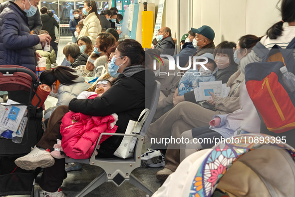 Patients with respiratory diseases are in the pediatric emergency department of Xinhua Hospital in Shanghai, China, on the night of January...