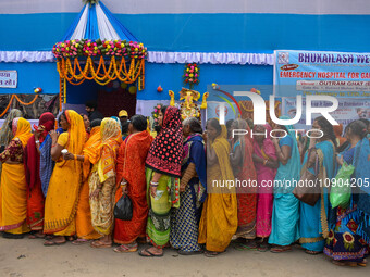 Devotees are queuing outside a free eye checkup camp at the Gangasagar transit camp in Kolkata, India, on January 11, 2024. (