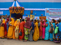 Devotees are queuing outside a free eye checkup camp at the Gangasagar transit camp in Kolkata, India, on January 11, 2024. (