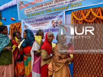 Devotees are queuing outside a free eye checkup camp at the Gangasagar transit camp in Kolkata, India, on January 11, 2024. (