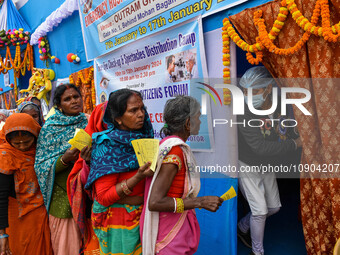 Devotees are queuing outside a free eye checkup camp at the Gangasagar transit camp in Kolkata, India, on January 11, 2024. (