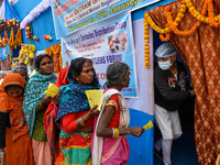 Devotees are queuing outside a free eye checkup camp at the Gangasagar transit camp in Kolkata, India, on January 11, 2024. (