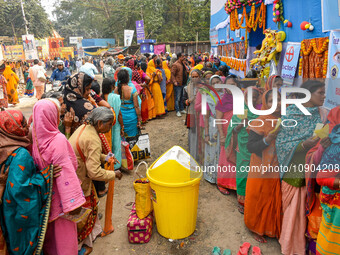 Devotees are queuing outside a free eye checkup camp at the Gangasagar transit camp in Kolkata, India, on January 11, 2024. (