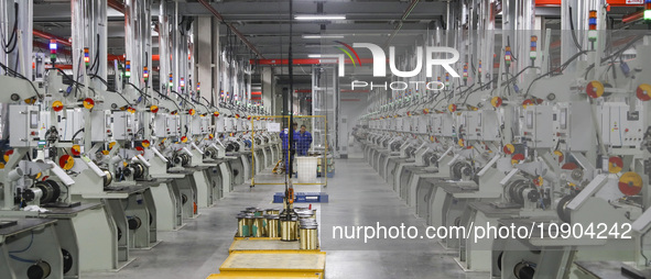 A worker is producing steel cord at a workshop in Huai'an, China, on January 11, 2024. 