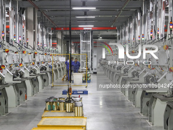 A worker is producing steel cord at a workshop in Huai'an, China, on January 11, 2024. (