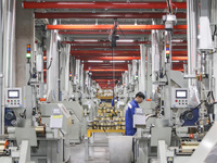 A worker is producing steel cord at a workshop in Huai'an, China, on January 11, 2024. (