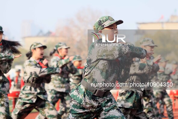 Children are demonstrating military boxing during a national defense education class at Bengbu Road No. 3 Primary School in Hefei, East Chin...