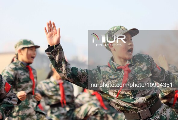 Children are demonstrating military boxing during a national defense education class at Bengbu Road No. 3 Primary School in Hefei, East Chin...