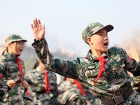 Children are demonstrating military boxing during a national defense education class at Bengbu Road No. 3 Primary School in Hefei, East Chin...