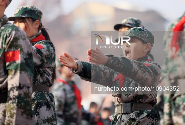 Children are demonstrating military boxing during a national defense education class at Bengbu Road No. 3 Primary School in Hefei, East Chin...