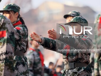 Children are demonstrating military boxing during a national defense education class at Bengbu Road No. 3 Primary School in Hefei, East Chin...