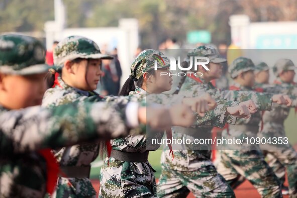 Children are demonstrating military boxing during a national defense education class at Bengbu Road No. 3 Primary School in Hefei, East Chin...