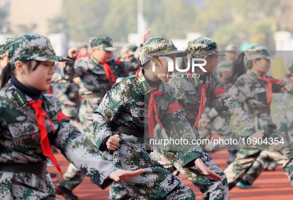 Children are demonstrating military boxing during a national defense education class at Bengbu Road No. 3 Primary School in Hefei, East Chin...