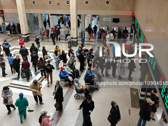 Many patients are waiting in the outpatient hall of a hospital in Shanghai, China, on January 11, 2024. (