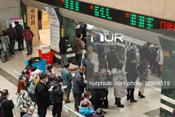 Many patients are waiting in the outpatient hall of a hospital in Shanghai, China, on January 11, 2024. 