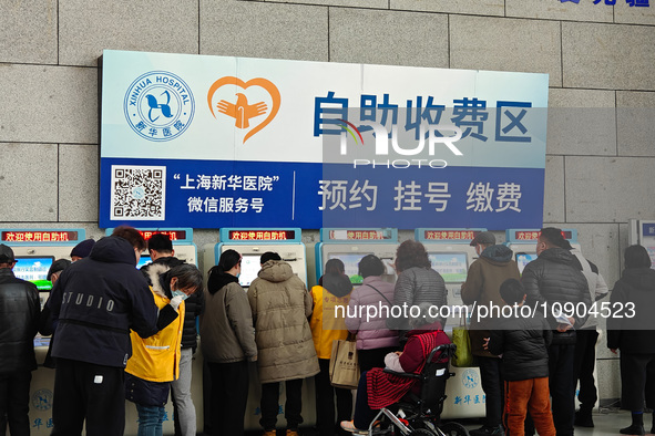 Patients are paying their bills at a hospital in Shanghai, China, on January 11, 2024. 