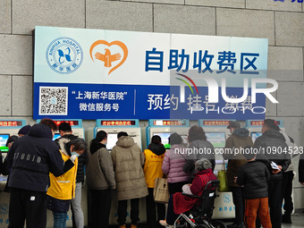 Patients are paying their bills at a hospital in Shanghai, China, on January 11, 2024. (