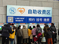 Patients are paying their bills at a hospital in Shanghai, China, on January 11, 2024. (