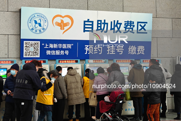 Patients are paying their bills at a hospital in Shanghai, China, on January 11, 2024. 