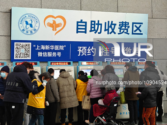 Patients are paying their bills at a hospital in Shanghai, China, on January 11, 2024. (