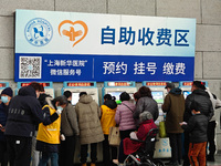 Patients are paying their bills at a hospital in Shanghai, China, on January 11, 2024. (